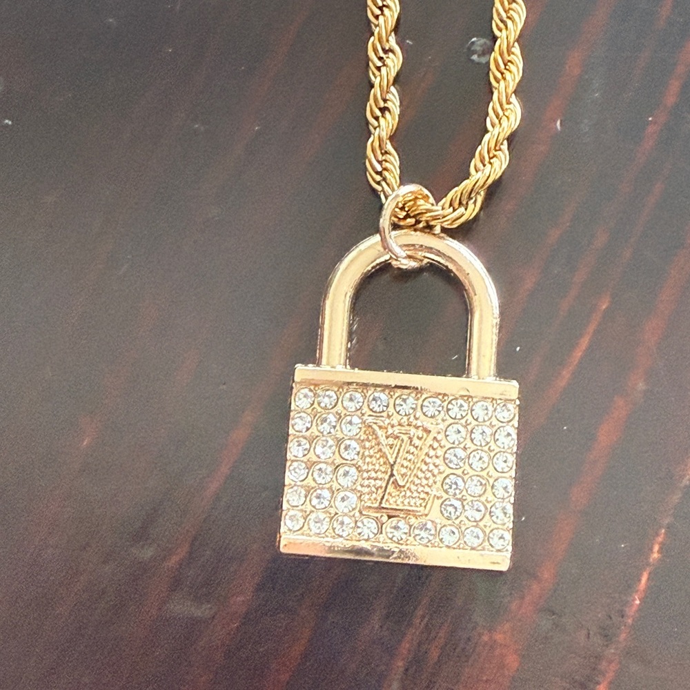 Lv EUC LV stamped lock pendant with 
crystals on 17” 18kt titanium steel chain